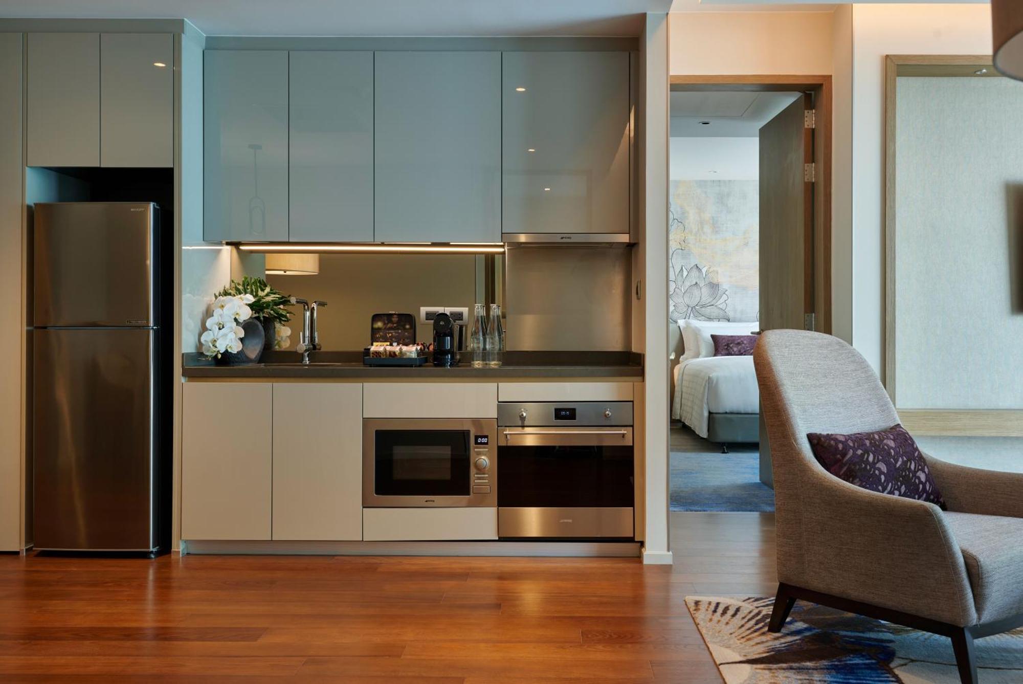 Chatrium Grand Бангкок Экстерьер фото A kitchen in a serviced apartment