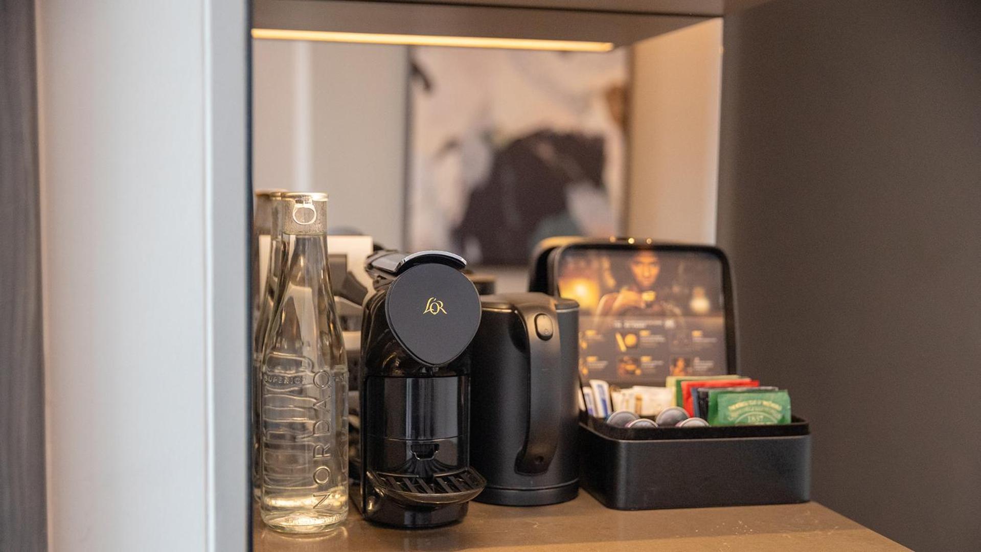 Chatrium Grand Бангкок Экстерьер фото A Nespresso coffee machine in a hotel room